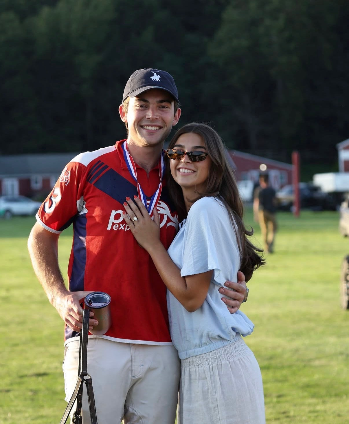 Landen and Taylor with their oval diamond bezel set engagement ring