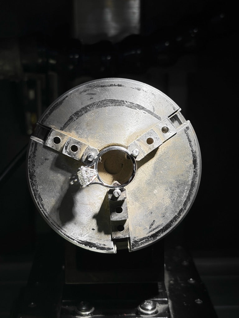 Custom ring secured in jewelry production equipment