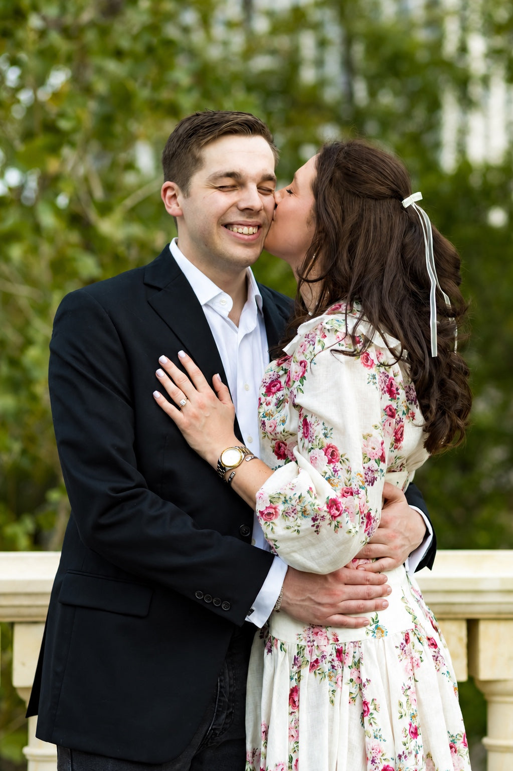 Anson and Maddie celebrating their engagement with the custom ring visible